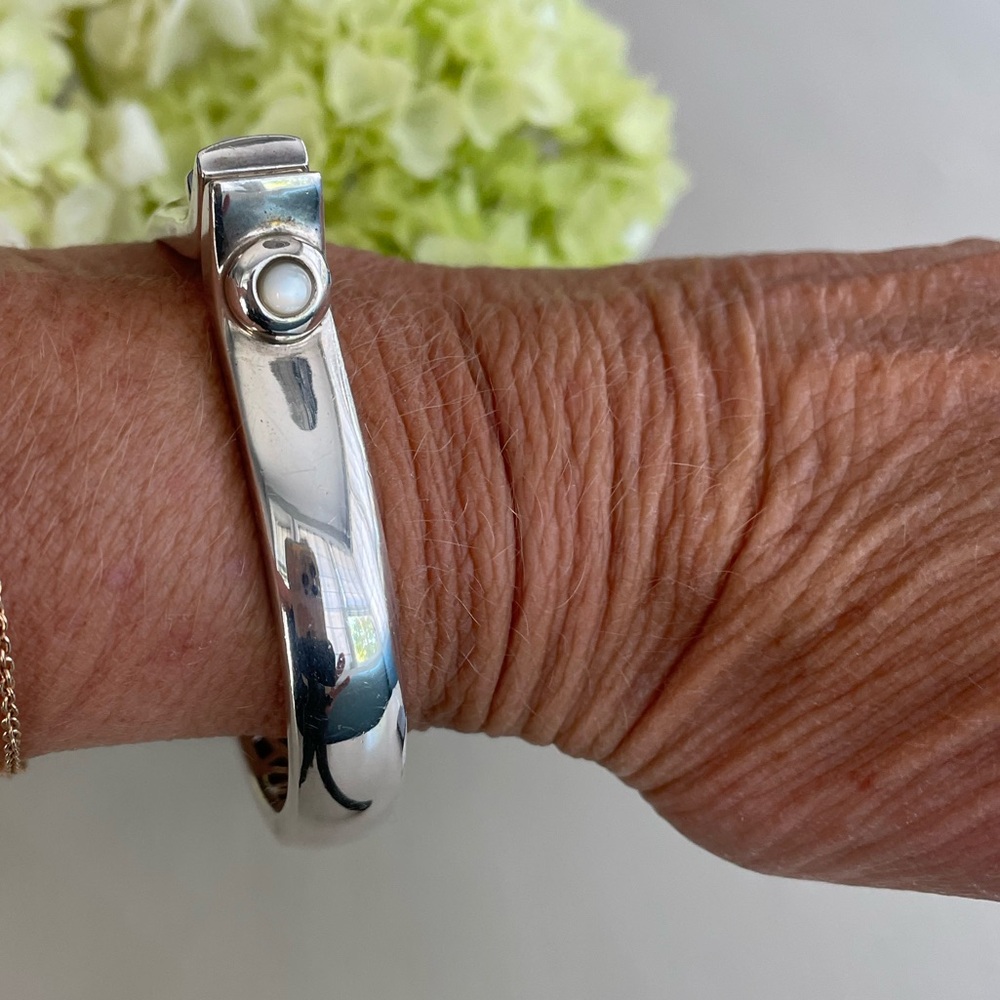 Elegant Kara Ross Silver Bangle with Moonstone Accent.